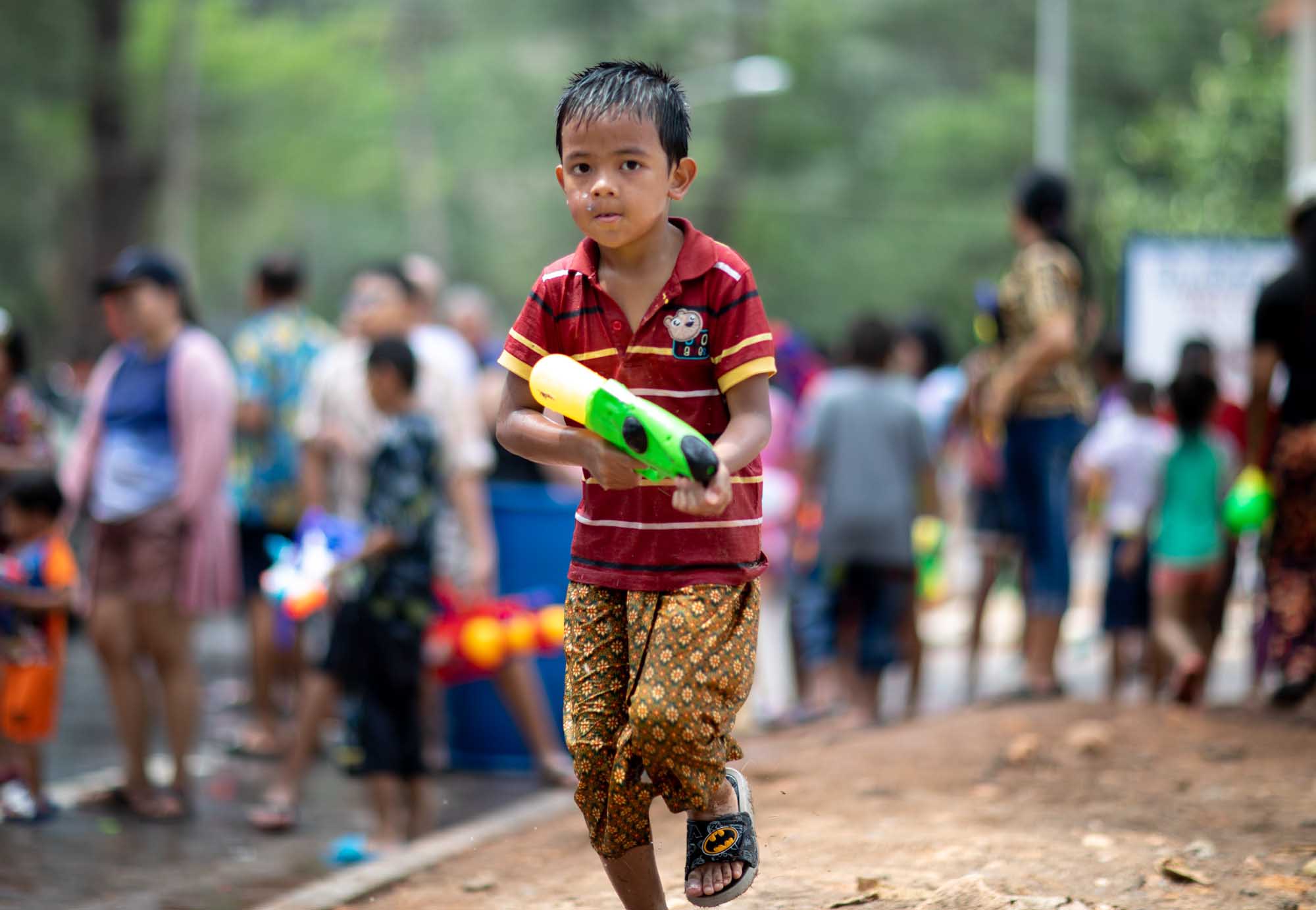 Boy ready to fight during Songkran water festival in Phuket, Thailand