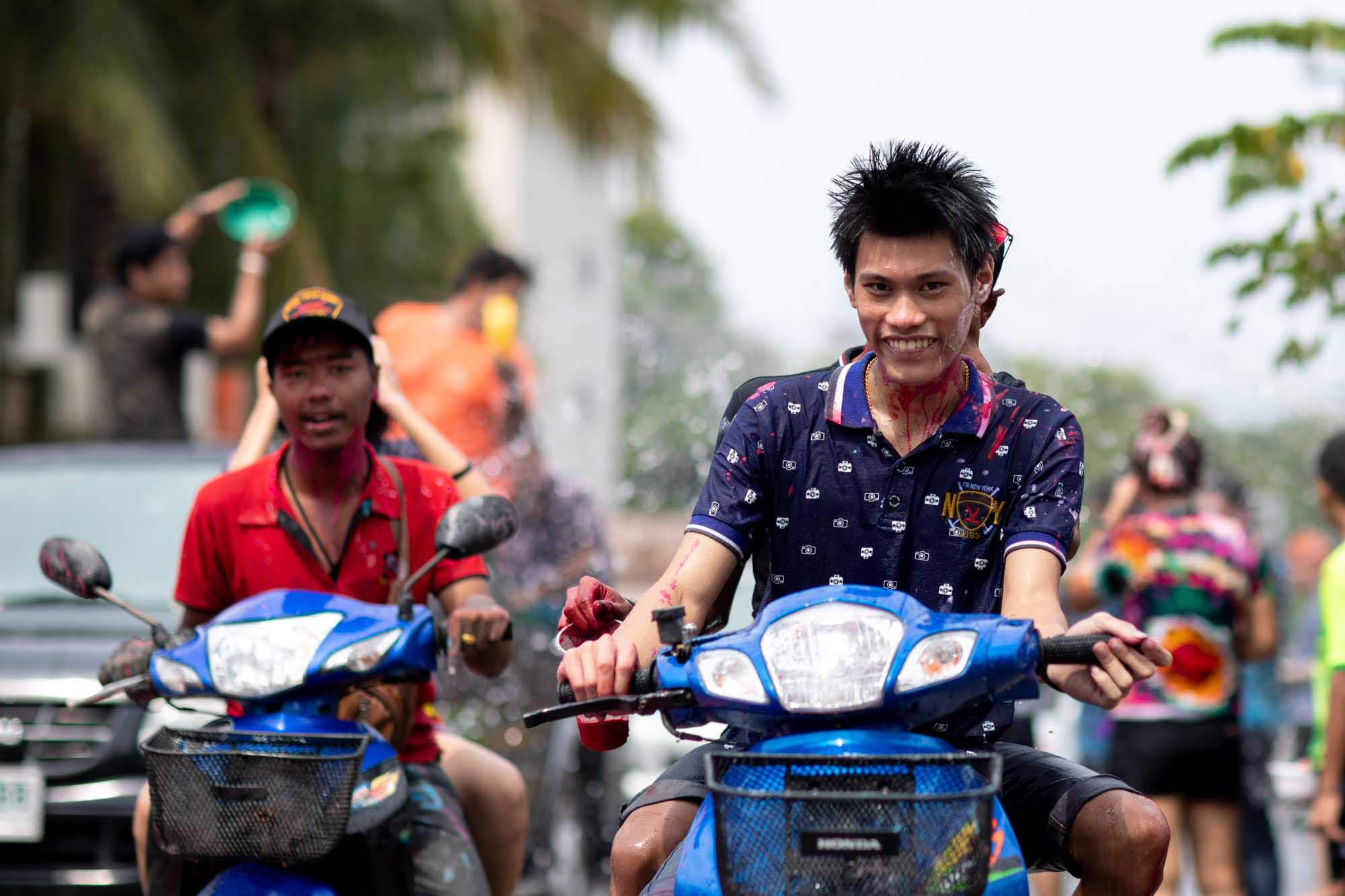 Smilng young man at Songkran water festival in Phuket, Thailand