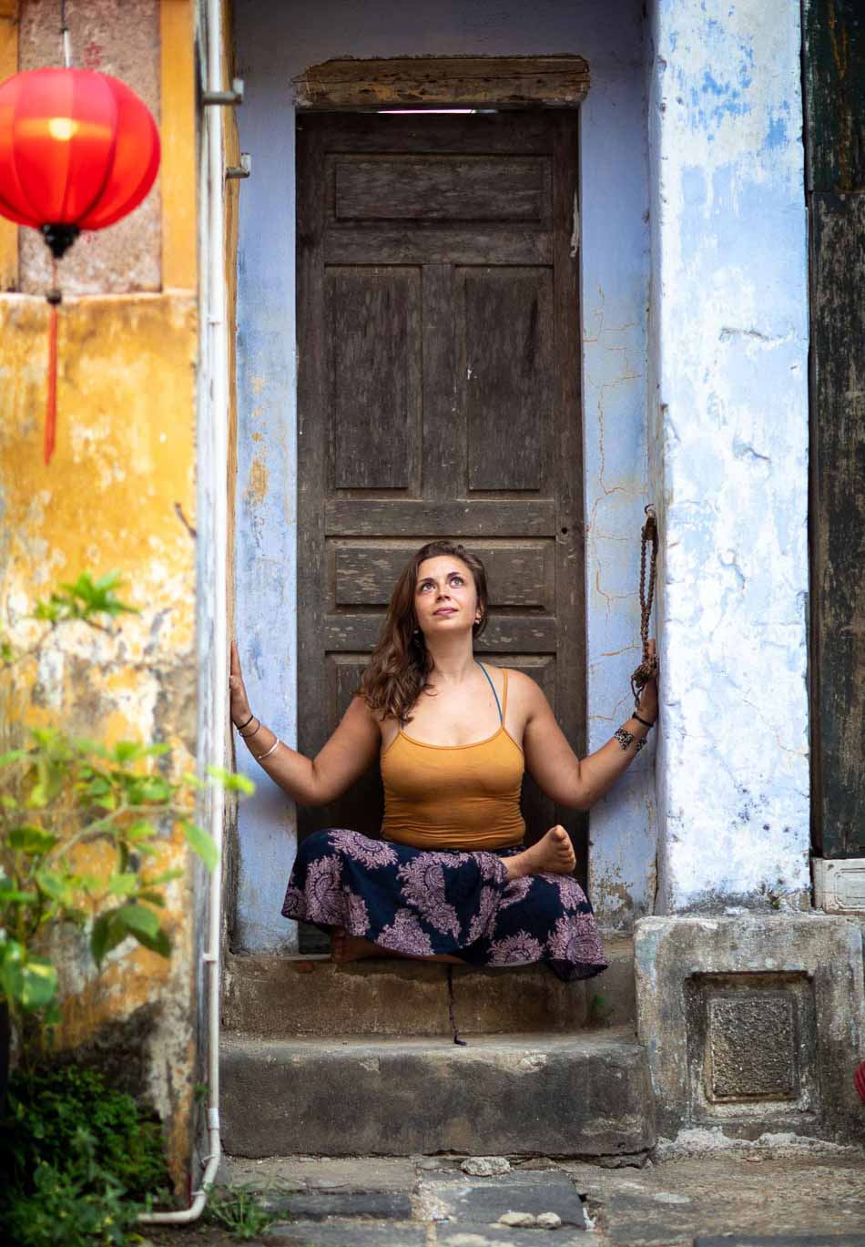 Woman meditating in doorway | Hoi An Vietnam | Yoga Photography | Travel Photography