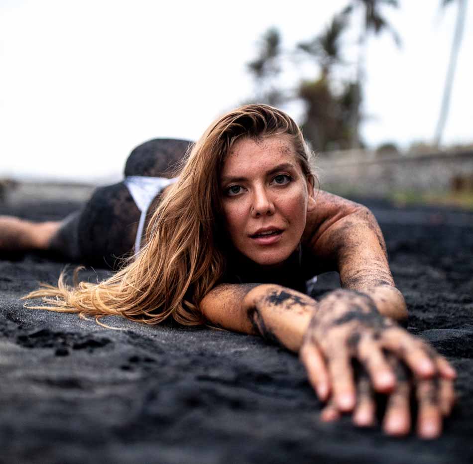 Ukrainian bikini model @alexa_air rolling around and getting dirty on a black sand beach | Swimwear | Lifestyle Photography | Canggu, Bali, Indonesia