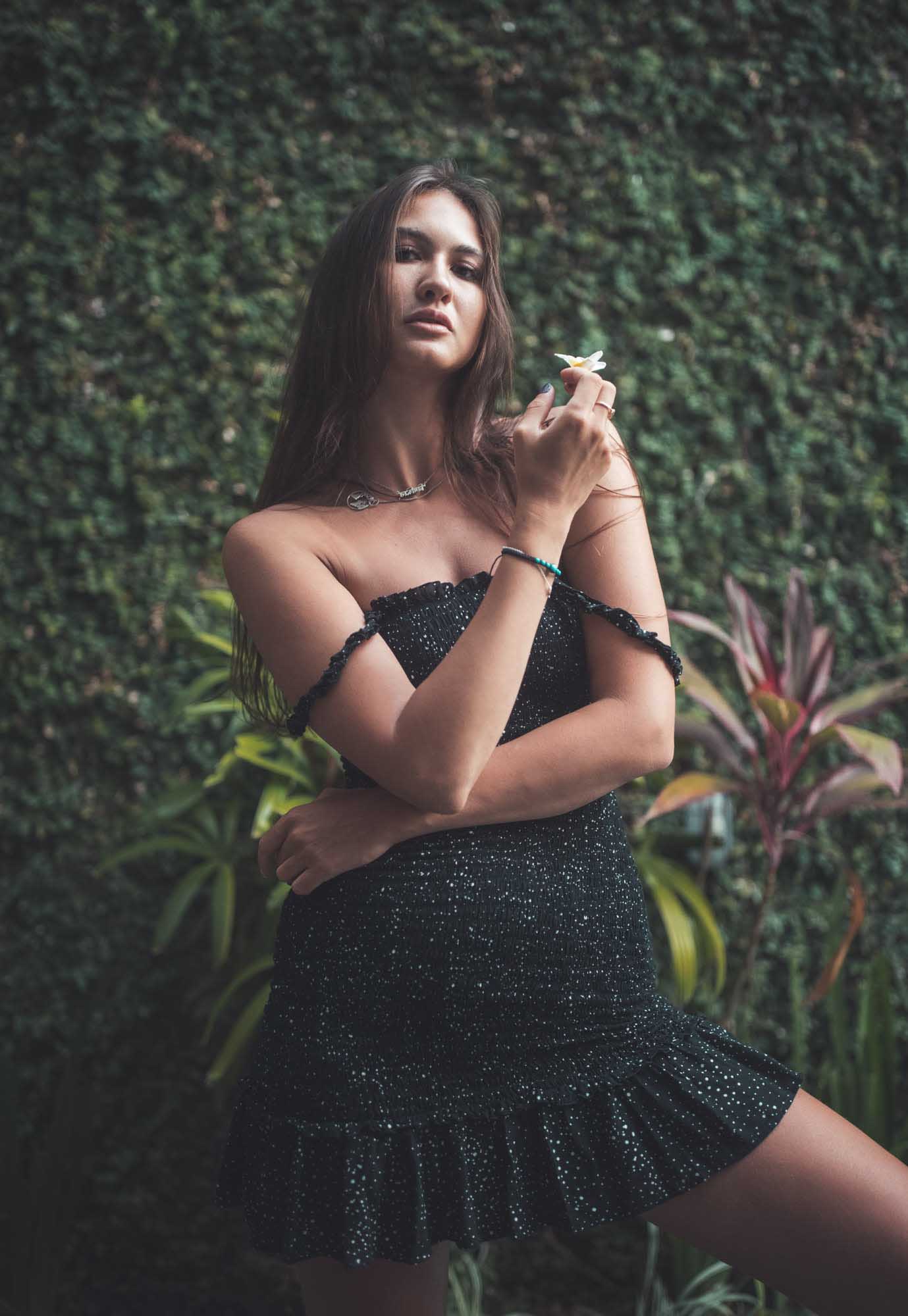 Woman in black dress poses with a flower | Fashion Photography | Portrait | Lifestyle Photography | Canggu ,Bali, Indonesia  | Denver Photographer