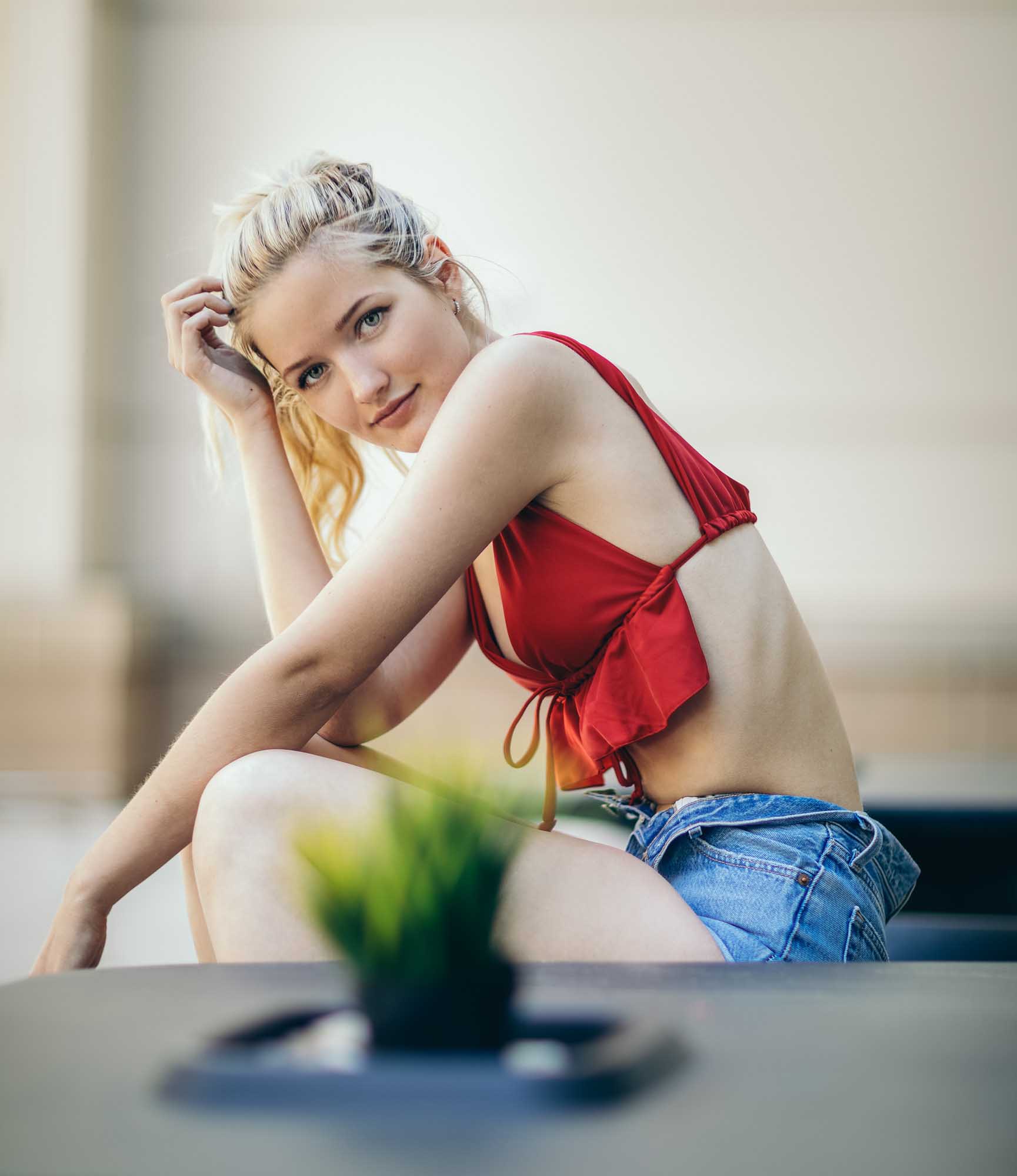 Model in red top and short jean shorts  | Meghan Travers @traversmeghan  | Fashion Photography | Denver, Colorado