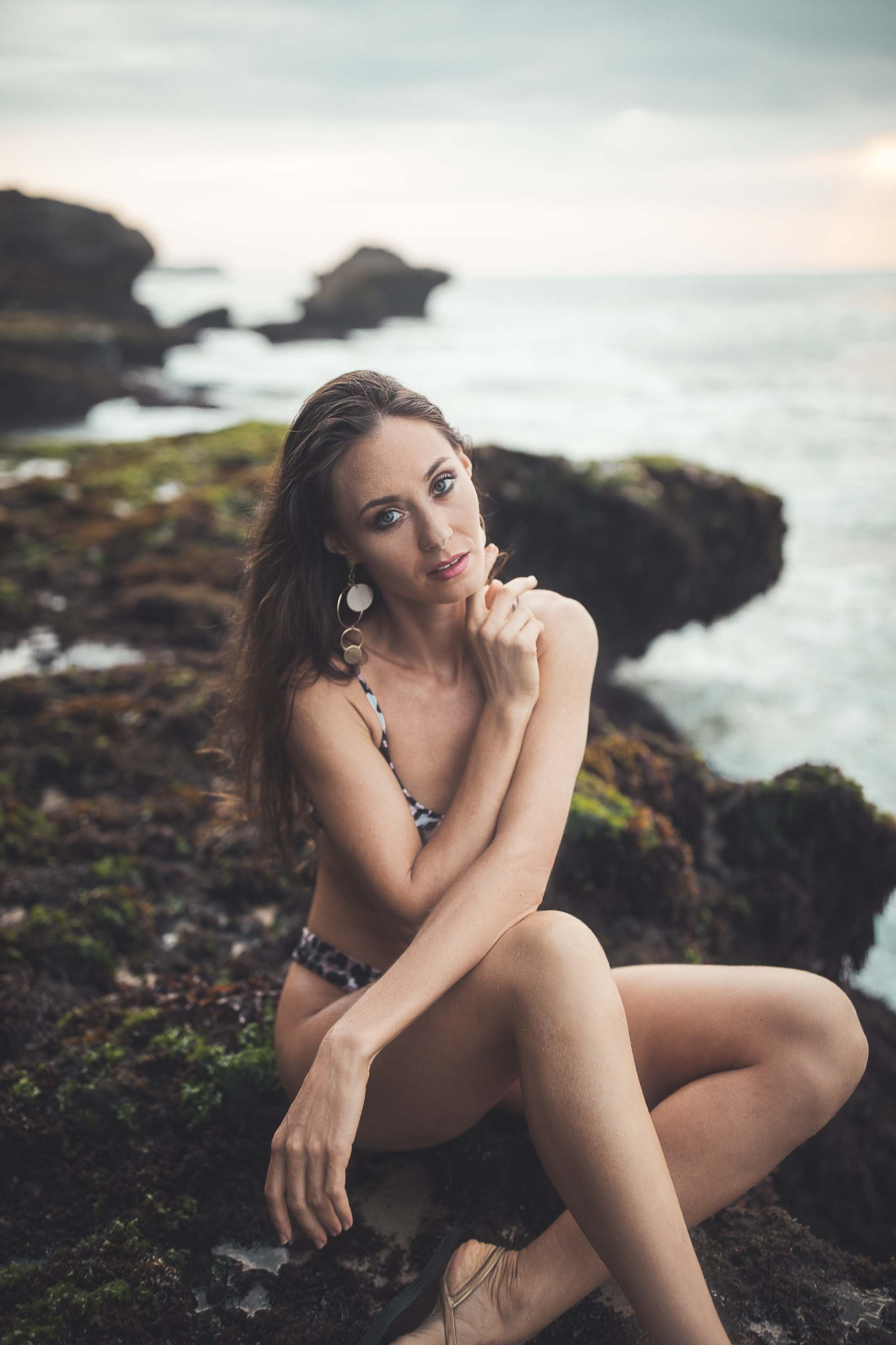 Bikini model poses in front of the sea
