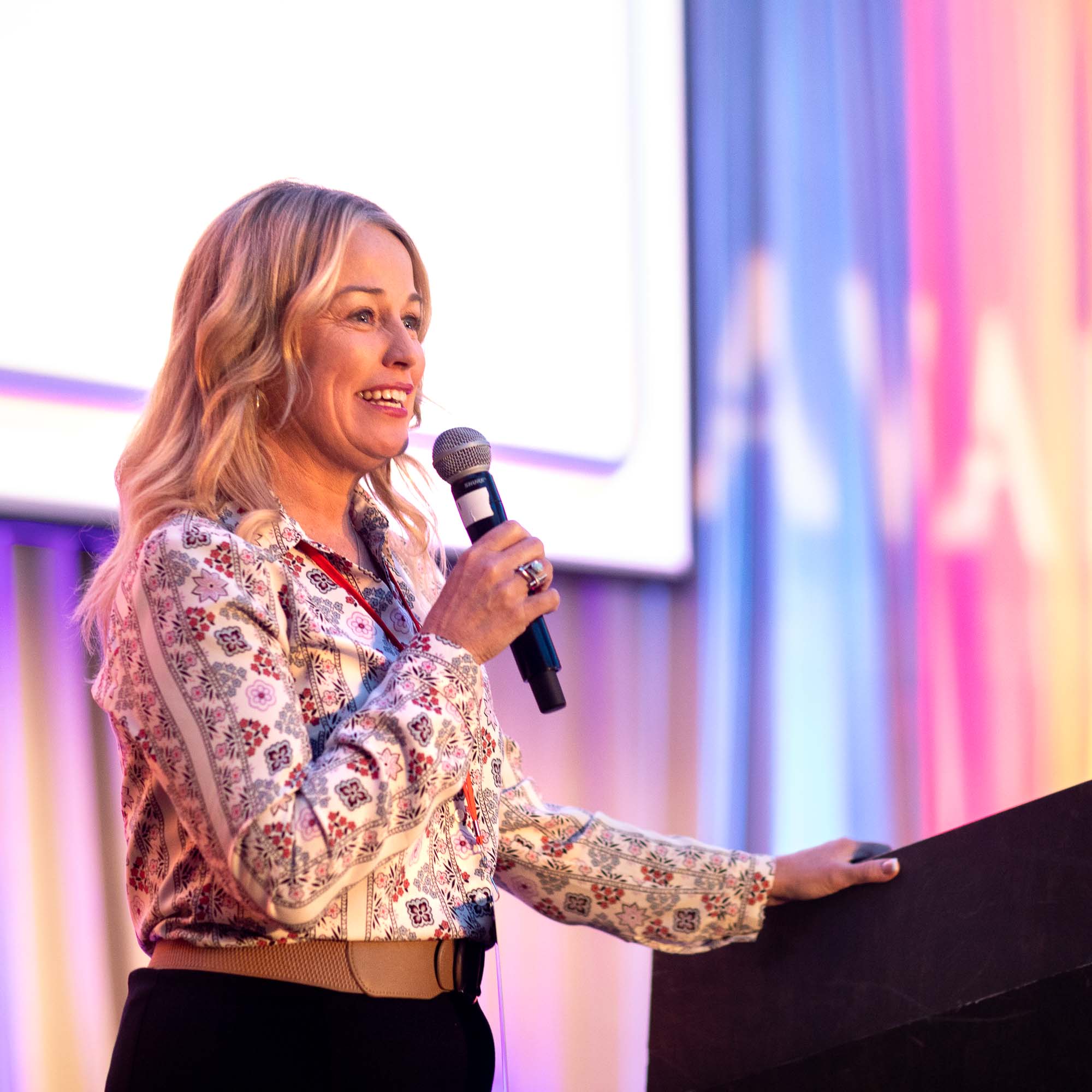 Woman giving a speech at a business conference