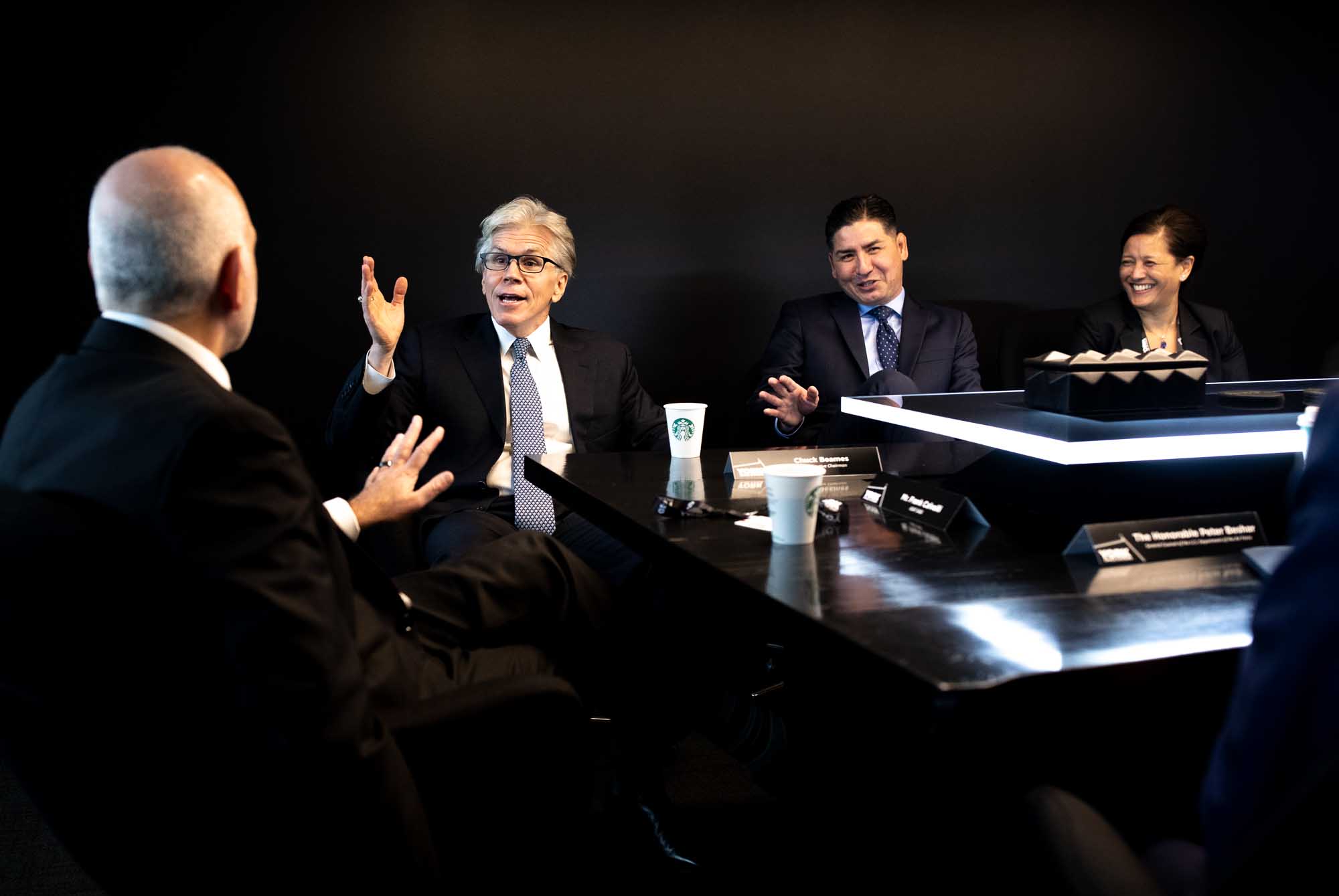 Businessmen having an animated discussion during corporate meeting
