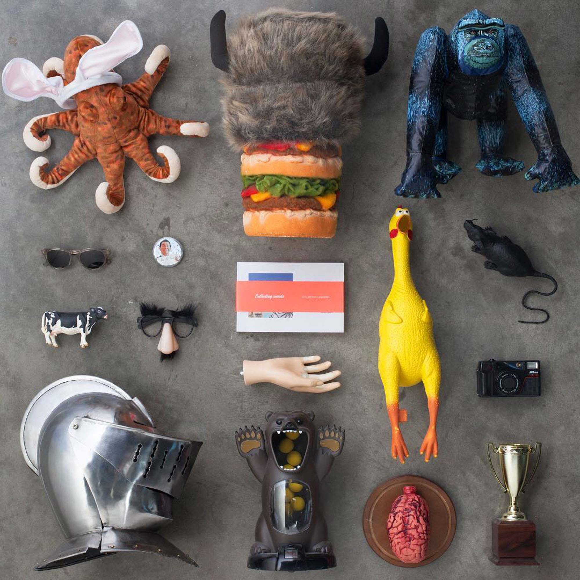 Knolling photography of eclectic objects arranged in an art director’s office