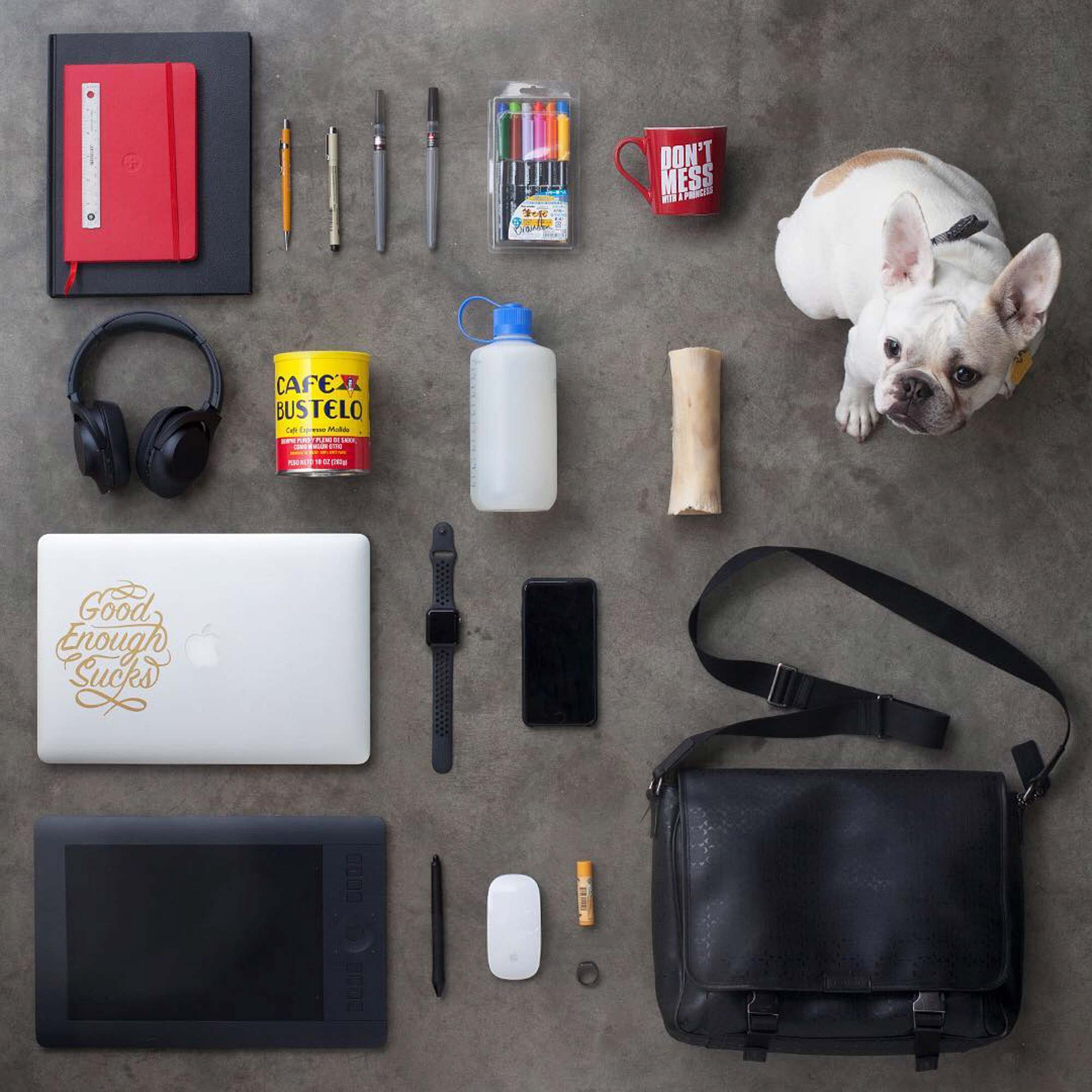 Knolling lifestyle photography featuring everyday work essentials and a dog, photographed by a Denver product photographer for Crispin Porter + Bogusky.
