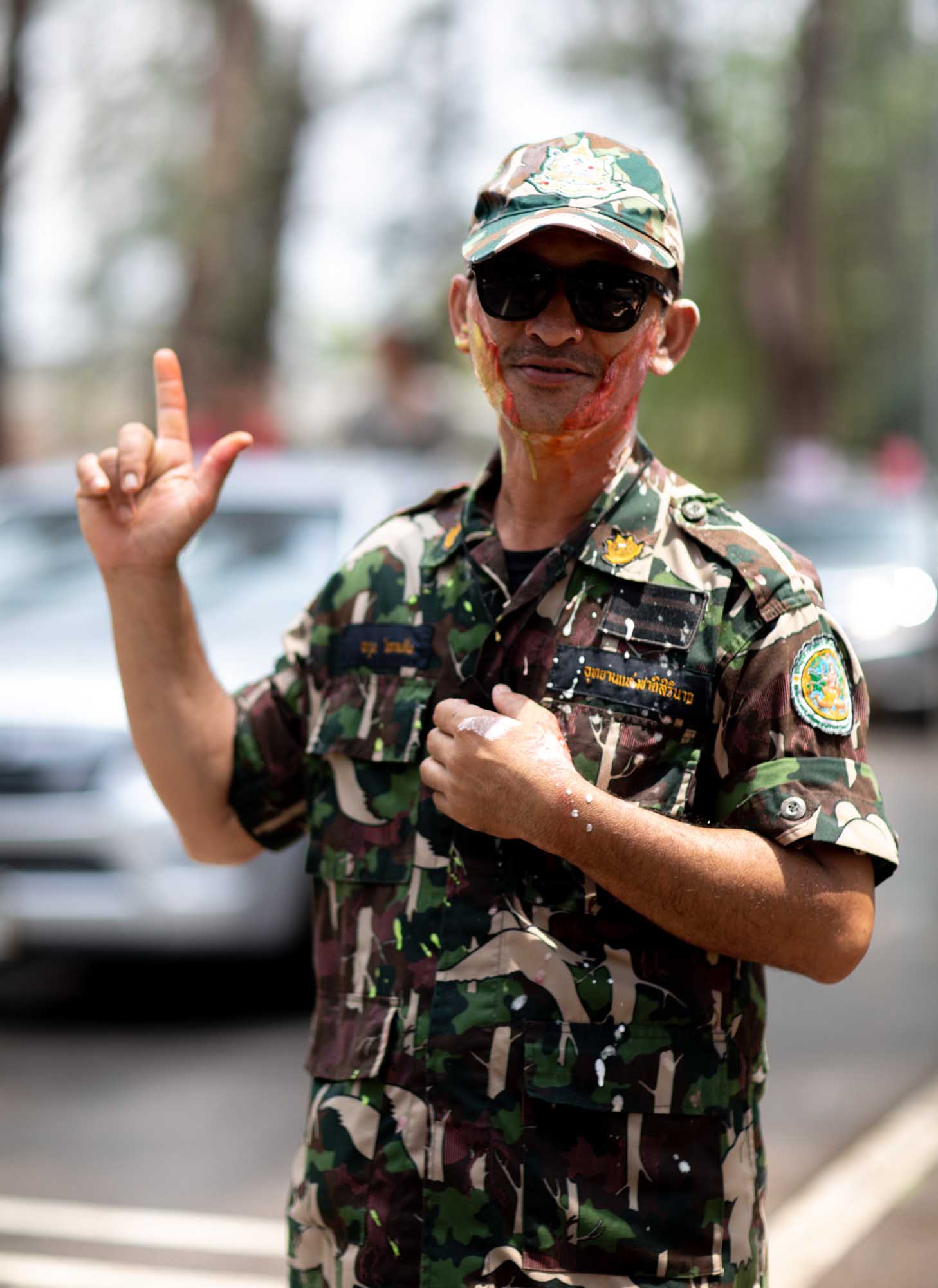 Thai Soldier with paint on his face during Songkran water festival in Phuket, Thailand